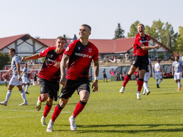 Cavalry FC react following a goal