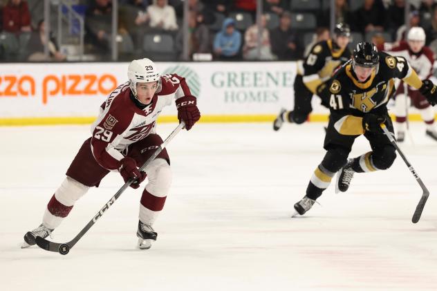 Peterborough Petes' Braydon McCallum and Kingston Frontenacs' Quinton Burns in action
