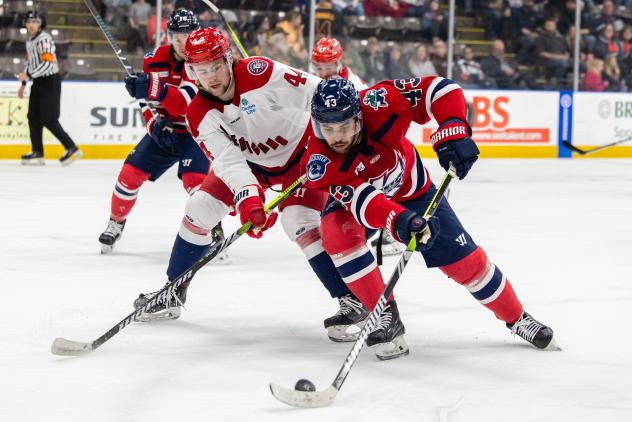 Allen Americans' Nolan Orzeck and Kalamazoo Wings' Quinn Preston in action