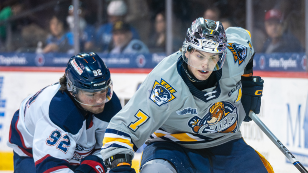 Saginaw Spirit's Nic Sima and Erie Otters' Owain Johnston on game night