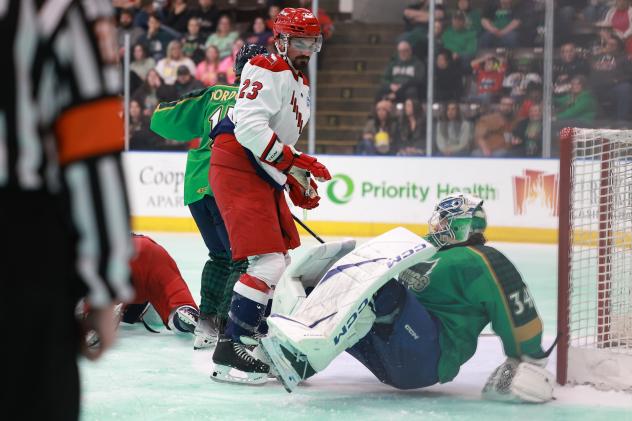 Allen Americans' Solag Bakich and Kalamazoo Wings' Jonathan Lemieux on the ice