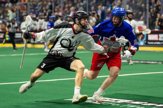 Colorado Mammoth defender Tim Edwards (left) vs. the Toronto Rock