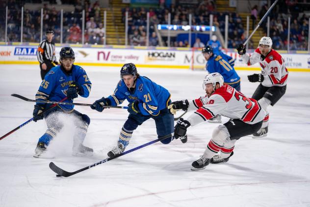 Springfield Thunderbirds' Dylan Coghlan and Joseph Duszak battle Charlotte Checkers' Andy Welinski