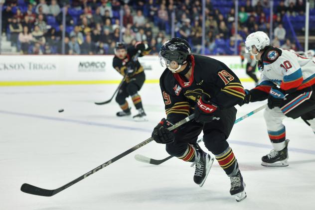 Vancouver Giants' Cameron Schmidt and Kelowna Rockets' Turner McMillen in action
