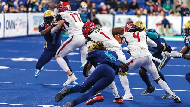 Jacksonville Sharks' Dimitrios Tsesmetzis, Tamorrion Terry, and Brion Murray in action