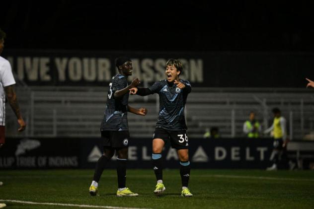 Tacoma Defiance's Georgi Minoungou and Yu Tsukanome celebrate win