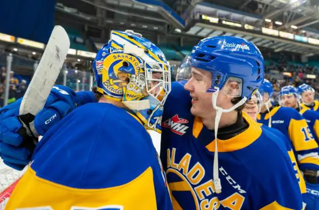 Saskatoon Blades' Evan Gardner and Brandon Lisowsky celebrate win