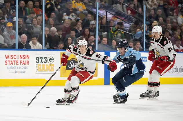 Grand Rapids Griffins' Amadeus Lombardi and Elmer Soderblom battle Milwaukee Admirals' Jake Livingstone