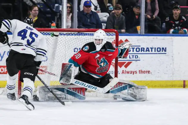 Wenatchee Wild's Steven Arp versus Kelowna Rockets' Jari Kykkanen