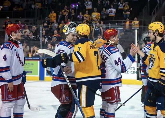 Kitchener Rangers' Jackson Parsons congratulated by Erie Otters' Owain Johnston