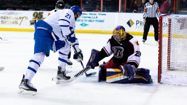 Wichita Thunder's Jay Dickman battles Rapid City Rush's Jason Pawloski