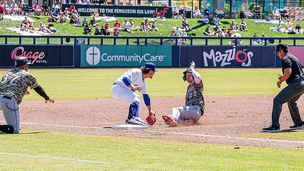 Taylor Young of the Tulsa Drillers makes the tag at third