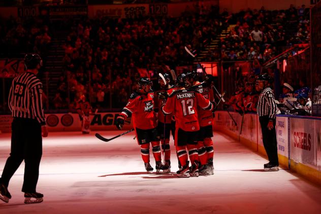 Kansas City Mavericks get together after a score