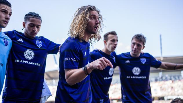 Louisville City FC defender Kyle Adams addresses the team