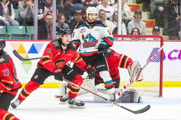 Kelowna Rockets look for a score in front of the Prince George Cougars goal