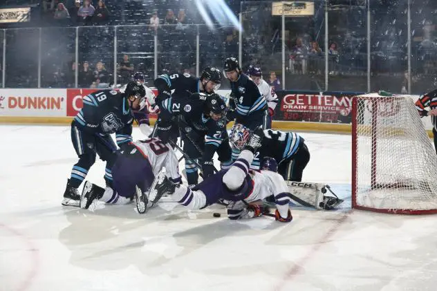 Youngstown Phantoms fight for a loose puck vs. the Madison Capitols