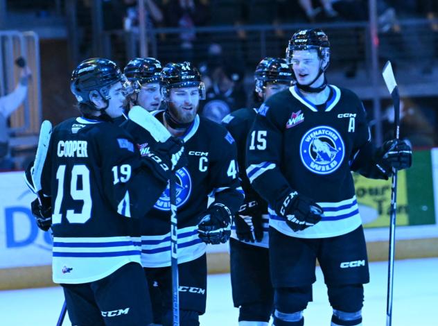 Wenatchee Wild forward Briley Wood (right, 15) and Graham Sward (center, 44)