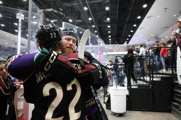 Tucson Roadrunners exchange hugs after a victory