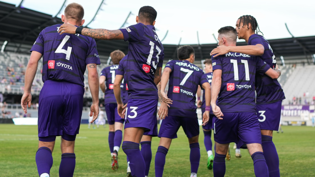 Louisville City FC exchanges congratulations following a goal