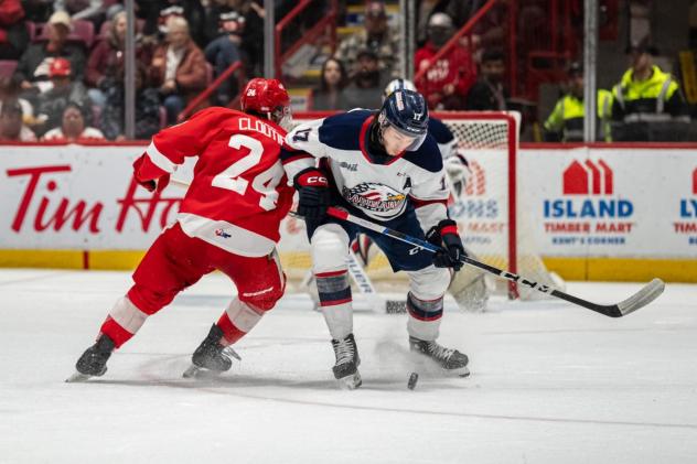 Soo Greyhounds' Justin Cloutier battles Saginaw Spirit's Josh Bloom