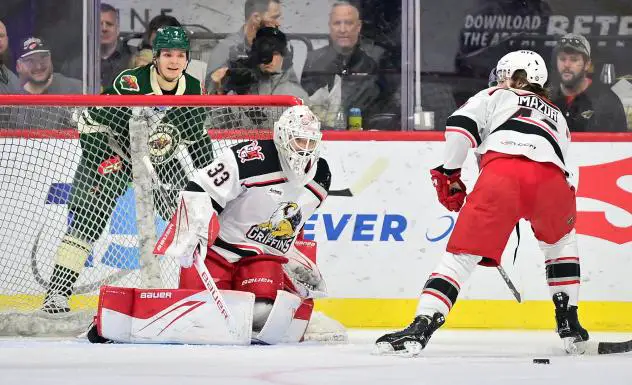Grand Rapids Griffins' Sebastian Cossa and Carter Mazur in action