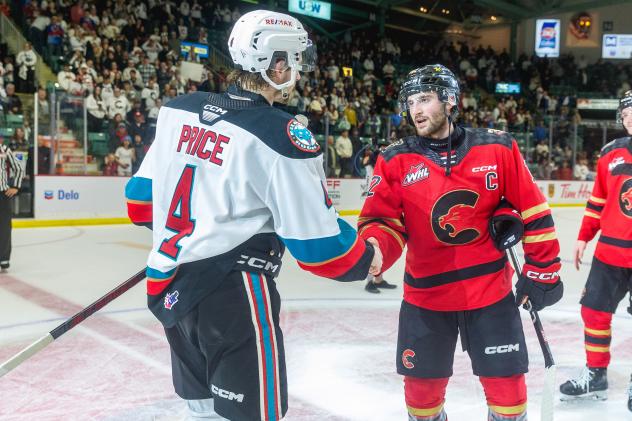 Kelowna Rockets' Caden Price congratulates Prince George Cougars' Hudson Thornton