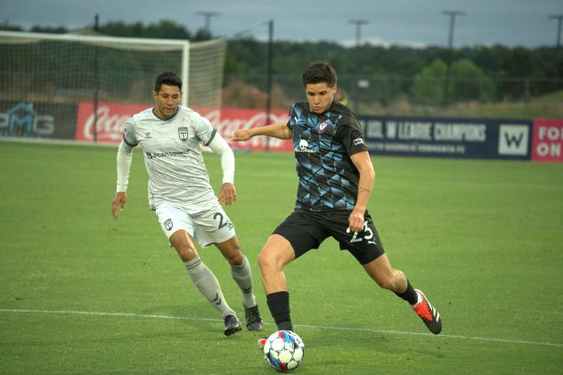 Greenville Triumph SC's Daniel Wu battles South Georgia Tormenta FC's Preston Kilwien