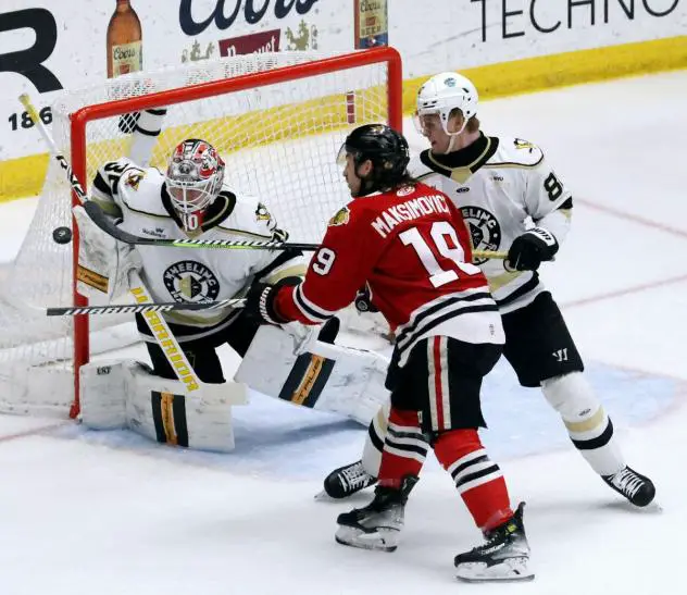 Wheeling Nailers' David Tendeck and Thimo Nickl and Indy Fuel's Kyle Maksimovich on game night