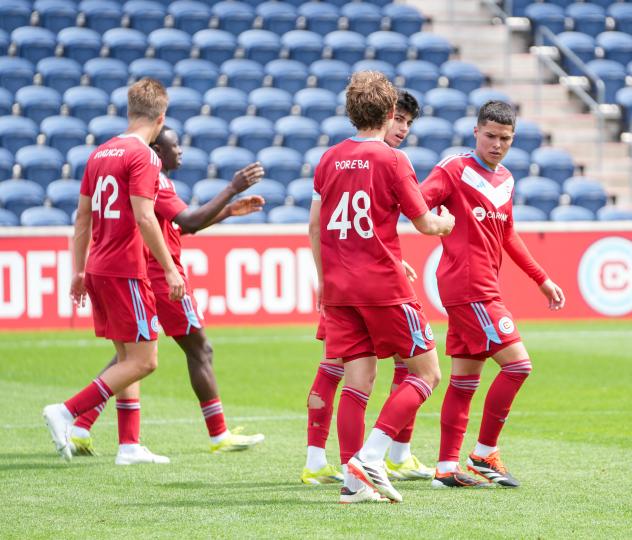 Chicago Fire FC II exhanges congratulations following a goal