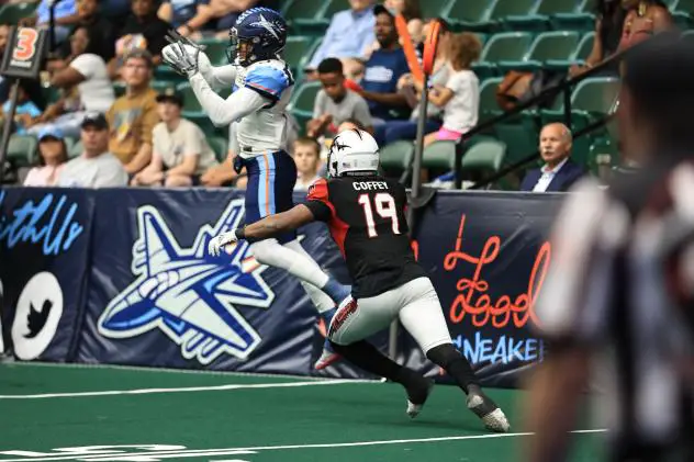 Jacksonville Sharks defensive back Richie Coffey zeroes in on a Frisco Fighters receiver