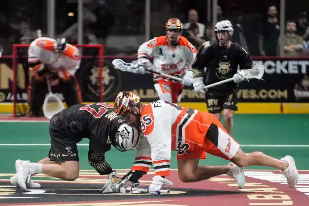 Mike Byrne of the Albany FireWolves (left) vs. Chase Fraser of the Buffalo Bandits