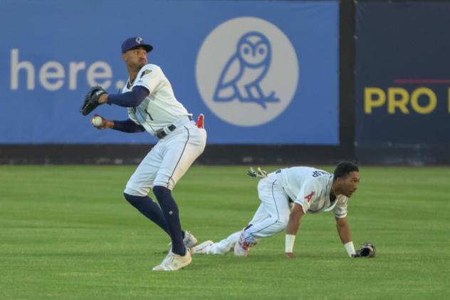 Tri-City Dust Devils left fielder Werner Blakely (standing) and shortstop Caleb Ketchup