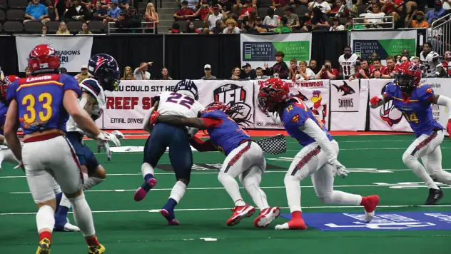 Jacksonville Sharks make a tackle against the Sioux Falls Storm