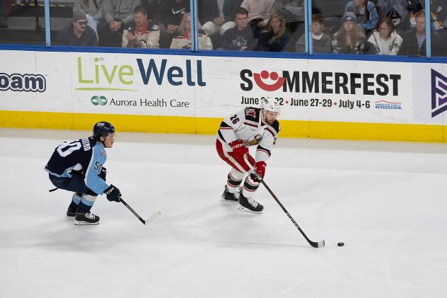 Grand Rapids Griffins left wing Tim Gettinger handles the puck vs. the Milwaukee Admirals