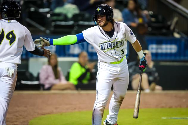 Columbia Fireflies' Blake Mitchell congratulated by Lizandro Rodriguez