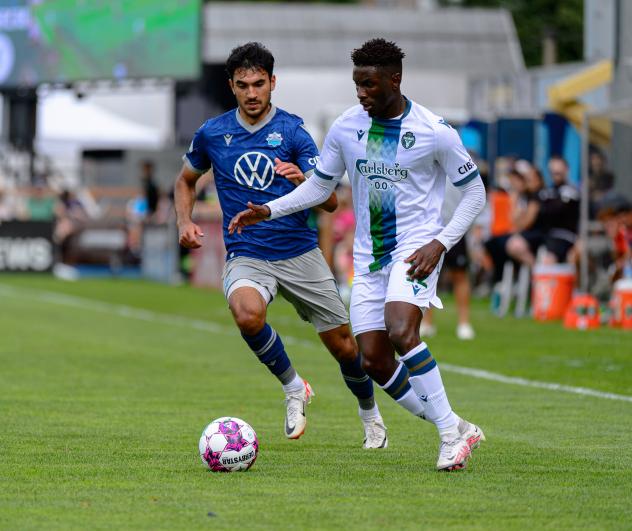 Winger Clément Bayiha with York United FC (right)