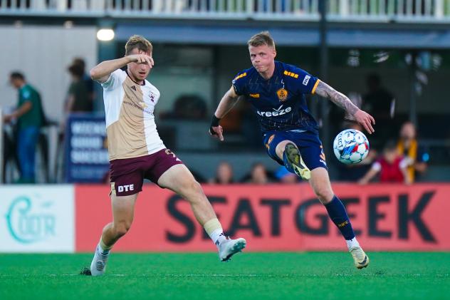 Rhode Island FC and Detroit City FC in action