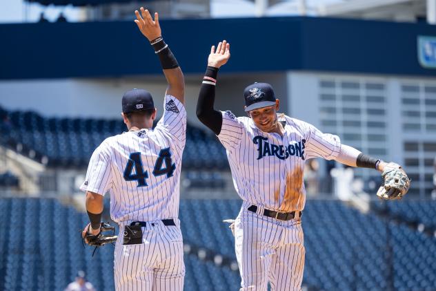 Dylan Jasso (left) and Hans Montero of the Tampa Tarpons exchange high fives