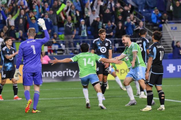 Seattle Sounders FC and Minnesota United FC on the field