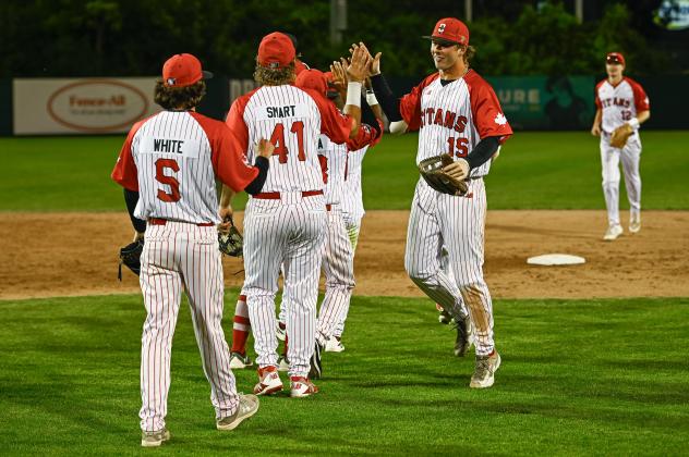 Ottawa Titans exchange congratulations following a victory