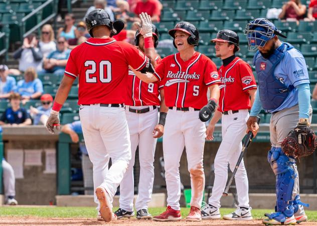 Fargo-Moorhead RedHawks exchange congratulations at the plate