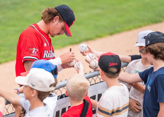 Fargo-Moorhead RedHawks sign autographs for the fans