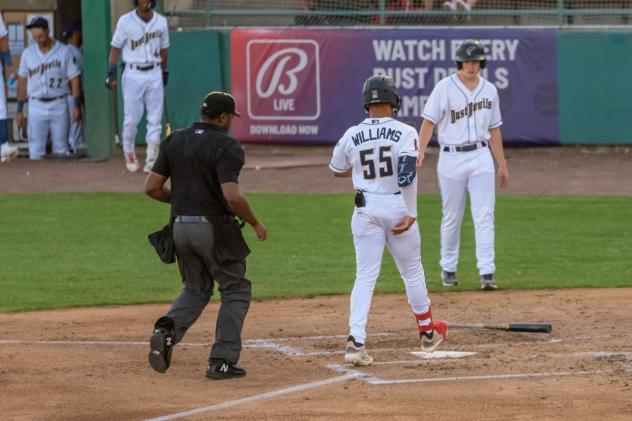 Tri-City Dust Devils first baseman Cam Williams comes in to score