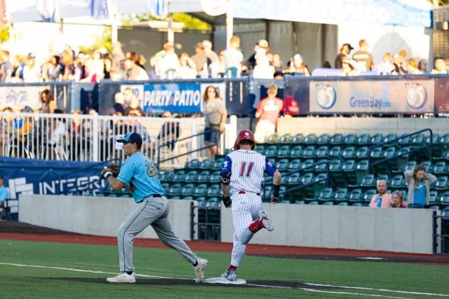 Green Bay Rockers infielder Sam Miller is safe at first