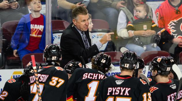 Don Nachbaur instructs his team on the Calgary Wranglers' bench
