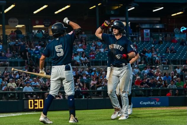 Somerset Patriots' Anthony Seigler congratulates Grant Richardson