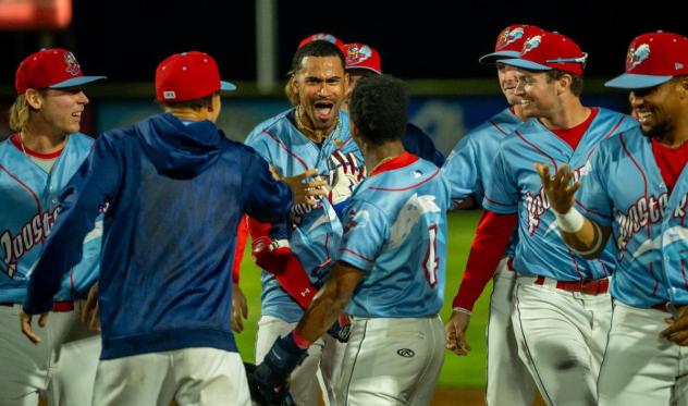 Tri-City Dust Devils, as the Rooster Tails, celebrate a walk-off victory
