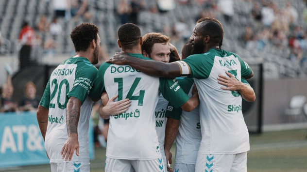 Birmingham Legion FC huddle up after a goal
