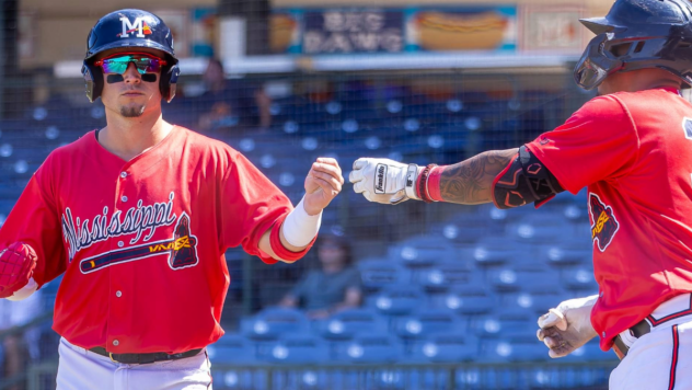 Mississippi Braves exchange fist bumps
