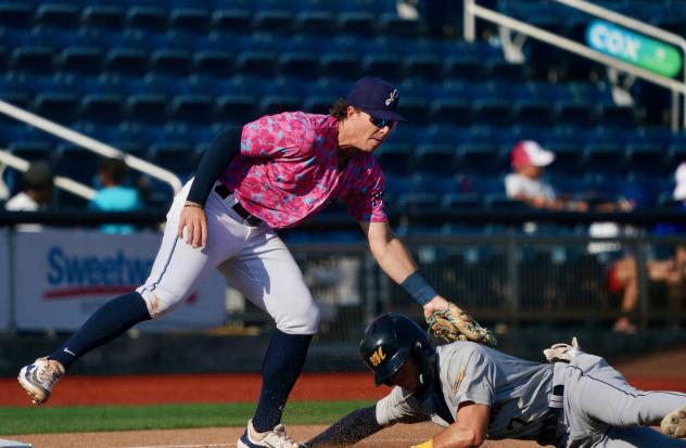 Pensacola Blue Wahoos apply the tag on the Montgomery Biscuits